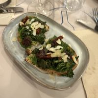 Crostone con cime di rapa pomodori secchi e mandorle tostate   at Piattini Caffè & Vini in Turin