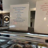 the sign to the right is specifying that they have 7 GF/V bagel options   at Crust & Crumb Bakery in Beach Haven