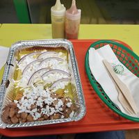 Pictured: ebchilladas suiza (a traditional Mexican dish of Swiss style ebchilladas only for the Christmas holiday) at Taqueria Vegana  in Toronto