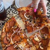 AMAZING pizza!! Both the regular and gf (cauliflower) crust are vegan. They also have vegan mozzarella, pepperoni, and chorizo, in addition to endless vegetable toppings.  at Bliss Beach in Daytona Beach Shores
