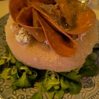 Pizzottella con mortadella vegana, brie vegano, tartufo e granella di pistacchio. at Magnebevo e sto a Ostiense in Rome