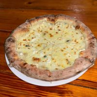 QUATTRO FORMAGGI ~ FOUR CHEESE PIZZA. AN OUTSTANDING PIZZA LOADED WITH IMPORTED CHEESES, HAND BLENDED WHEN WE MAKE IT FRESH!! NO RED SAUCE
ENJOY!! at HoiAnPizza in Hoi An