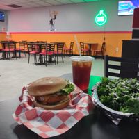 Buffalo Chicken Burger, meal combo w/ mini kale salad, & sweet tea. at Romeo's in Asheville