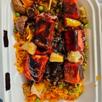 Tofu skewers on dirty rice at Chef Safari's African Fusion in Durango