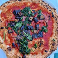 Pizza marinara with extra veggies at CN45 in Procida
