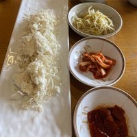 Side dishes. We asked no dressing on salad but added soy sauce. It was so good. Bean sprout side dish was very delicious with sesame oil flavoring  at Kongppadu - 콩빠두 in Seoul