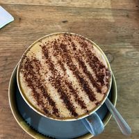 Cappuccino with oat milk and chocolate   at 3 Wise Monkeys Climbing Cafe in Fort William