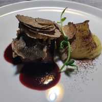Redefine meat with red wine sauce, hazelnuts, truffle shavings, and potato puree at Soul Kitchen - Creatività Vegetale in Turin