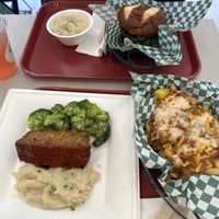  Top left, clockwise: BlackBerry lemonade, garlic mashed potatoes, spicy chicken sandwich, Ultimate fries/tots, and meatloaf plate.   at Othello's in Woodland Hills