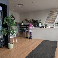 The bright location with the take-out fridge and freezer on the left, counter in front and seats are on the right (not in the photo). at Chef Veganessa in Kirkland