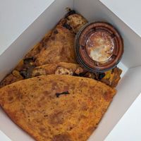 Vegan chick'n quesadilla with sauce. at Chef Richie Deli in Hudson