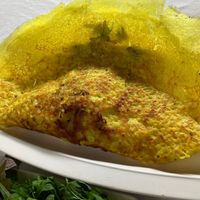 Bánh Xèo, big as your head, contains egg in filling. at Magnolia Veggie Restaurant in Phnom Penh