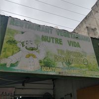 Exterior sign (with old, incorrect phone number) at Nutre Vida in Guayaquil