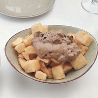 Patatas bravas con allioli de ajo negro at La Capella in Sabadell