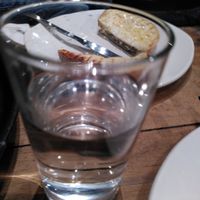 Glass of water (January 2025) at Caffè Nero in Aberystwyth