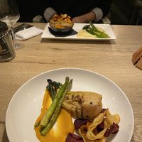 Front: vegan cabbage steak, back: vegan stew  at Waanzinnig Tilburg in Tilburg