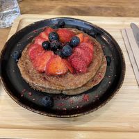 Vegan pancakes with berries and maple syrupsyrup  at RootBark EtnoBrunch in Redondela