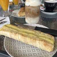 Greek Potato pie and Oat milk iced latte   at Bakery and Coffee Shop Nisaki in Corfu