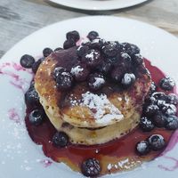 Vegan pancake stack and loaded fries at The Lookout Cafe in Weymouth