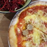 'Meaty' pizza and a fresh salad bowl at Black Cat in East London