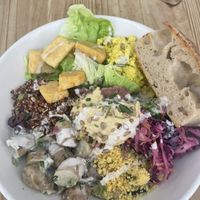 Tofu scramble, marinated tofu, potato salad, veggies, couscous   at Black Cat in East London