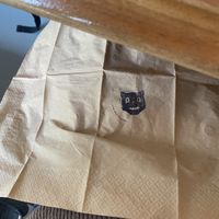 Cat stamp on serviette  at Black Cat in East London