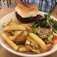 Burger, salad and chips. at Black Cat in East London