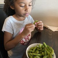 Edamame (and a cutie) 🥰   at Sirirath Thai House in Fargo
