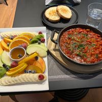 Fruit platter and vegan shakshuka  at Bitter in Tirana
