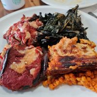 Parmigiana, lasagne and coste at La Pentola Vegana in Monza