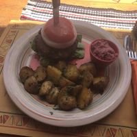 Vegan burger with baked potatoes and beetroot hummus at Tranquilo in Santorini