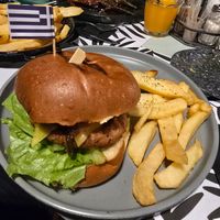 Vegan burger, side of chips, and Imam aubergine at Kalomirakis Tavern in Crete