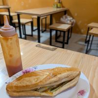Banh mi and cat in the back at Hem Vegan in Hanoi