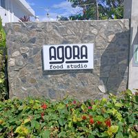 Find this sign close to the back of the plaza at Agora Food Studio in Dili