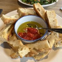 Focaccia with cashew ricotta and cherry tomatoes  at Wheat Penny Oven and Bar in Dayton