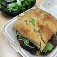 Mushroom Milanese sandwich with a side saladd  at Wheat Penny Oven and Bar in Dayton