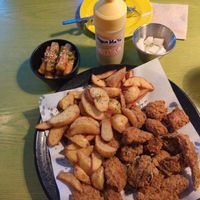 Vegan chicken, fries, rice cakes, and picked radish. at Chicken in the Kitchen in Seoul
