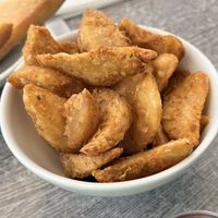 Fried potato wedges   at Paulina Escanes in San Juan