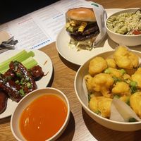 Cauli bites, mac burger, pesto pasta and chicken wings   at Veggie Grill by Next Level - Downtown in Seattle