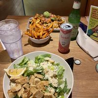 Caesar salad with tempeh, sweet potato fries, chikin tinga nachos  at Veggie Grill by Next Level - Downtown in Seattle