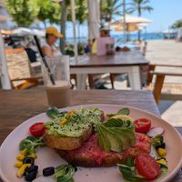 Avocado and tomato on toast with iced cappuccino (oat milk) at Brunchit in Ibiza