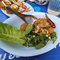 Foreground: vegan chicken popcorn. Background: tofu skewers at muan in South West London