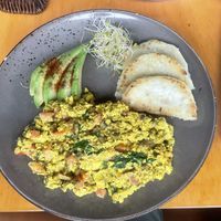 Tofu scramble with corn cakes  at Raw Cafe in Lima