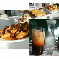 Thai iced tea, egg rolls, cheez fries, and orange chicken at My Vegan Gold in Los Angeles