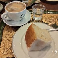 Coffee with oat milk & vegan lemon drizzle cake. at Café Wunderbar in Wiesbaden