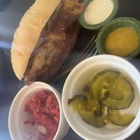 Hot dog with accompaniments  at Cocina Libre in San Jose