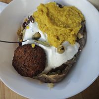 baked potato with frikadelle and daal at Die Waffel in Frankfurt