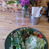 Grilled asparagus with mushroom sauce and baked potatoes at Avocado Vegan Bistro in Gdansk