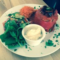 Roasted red pepper, stuffed with millet and vegetables.  at Avocado Vegan Bistro in Gdansk
