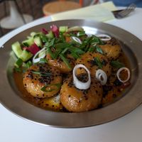 Potato dumplings in spicy Asian-style oil. Perfect at DAMKA • cafè & bakery in Krakow